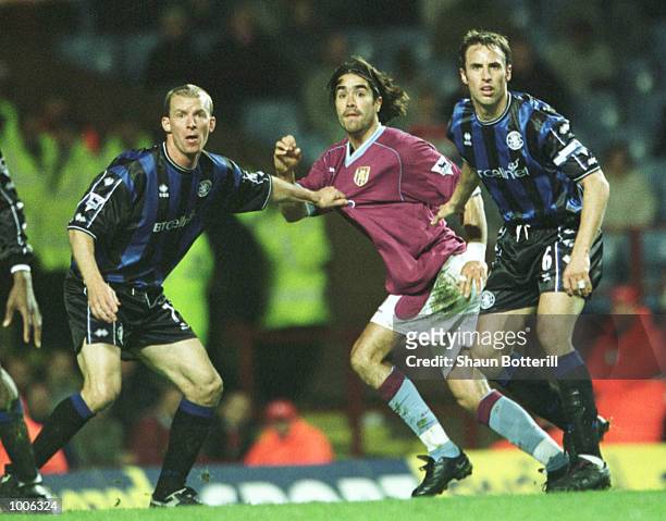 Juan Pablo Angel of Aston Villa is held off by Robbie Mustoe of Middlesbrough and Gareth Southgate during the FA Barclaycard Premiership match...