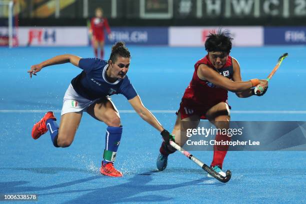Chiara Tiddi of Italy tackles Mi Hyun Park of Korea during the Pool A game between South Korea and Italy of the FIH Womens Hockey World Cup at Lee...