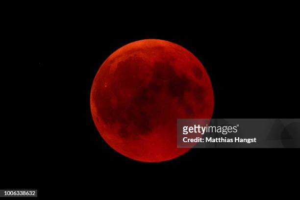 Blood Moon rises above The Hohenzollern Castle, the ancestral seat of the Prussian Royal House and of the Hohenzollern Princes, situated at the...