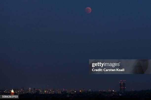 Blood Moon rises over the skyline on July 27, 2018 in Berlin, Germany. The period of totality during this eclipse, when Earth's shadow is directly...