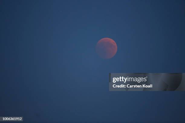 Blood Moon rises over the skyline on July 27, 2018 in Berlin, Germany. The period of totality during this eclipse, when Earth's shadow is directly...