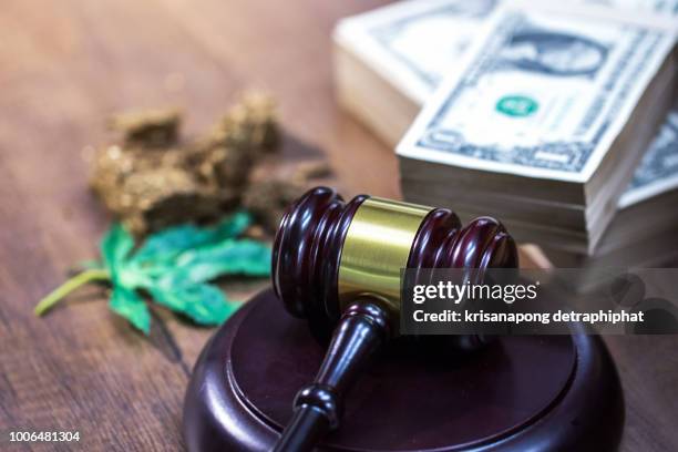 judge hammer with sound block on the desk background - legality of cannabis, legal and illegal cannabis on the world. - judges table stock pictures, royalty-free photos & images