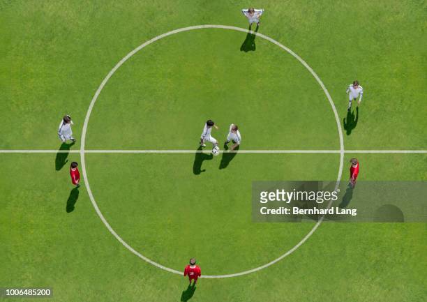 kick-off on soccer field, aerial view - aerial football stock-fotos und bilder