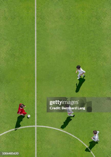 soccer players facing opponents, aerial view - soccer team stock pictures, royalty-free photos & images