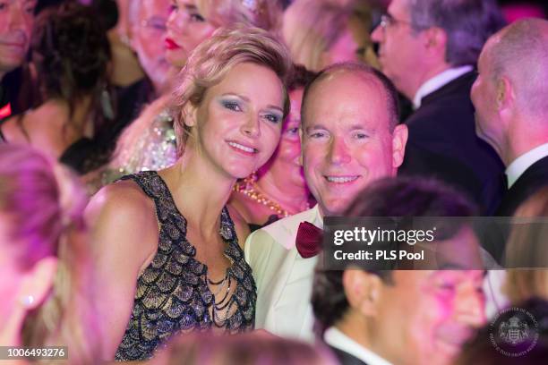 Princess Charlene of Monaco and Prince Albert II of Monaco pose duing the dance at the 70th Monaco Red Cross Ball Gala on July 27, 2018 in...