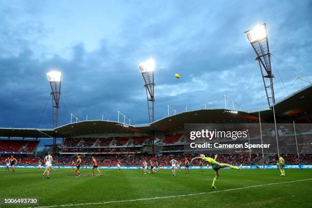 The ball is thrown into play by a boundary umpire during the round 19 AFL match between the Greater Western Sydney Giants and the St Kilda Saints at...