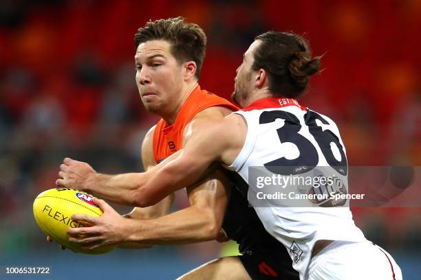 Toby Greene of the Giants is tackled during the round 19 AFL match between the Greater Western Sydney Giants and the St Kilda Saints at Spotless...