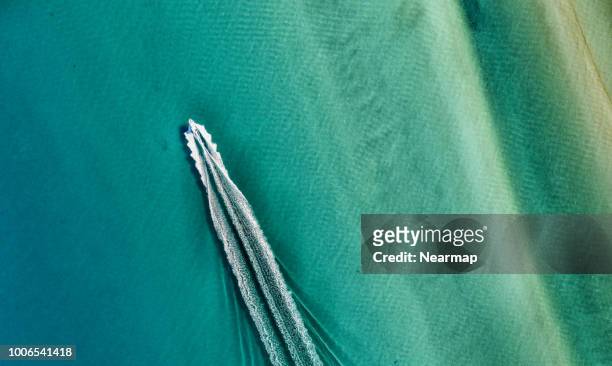 aerial view of yacht in the ocean. australia - victoria aerial stock pictures, royalty-free photos & images