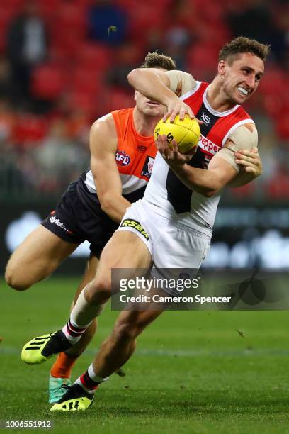 Luke Dunstan of the Saints is tackled during the round 19 AFL match between the Greater Western Sydney Giants and the St Kilda Saints at Spotless...
