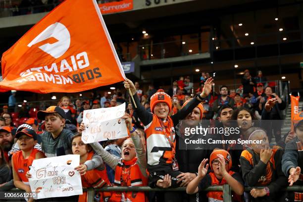 Giants fans celebrate winning the round 19 AFL match between the Greater Western Sydney Giants and the St Kilda Saints at Spotless Stadium on July...