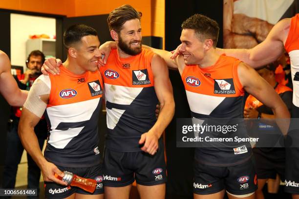 Dylan Shiel, Callan Ward and Josh Kelly of the Giants celebrate winning the round 19 AFL match between the Greater Western Sydney Giants and the St...