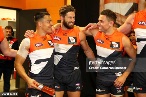 Dylan Shiel, Callan Ward and Josh Kelly of the Giants celebrate winning the round 19 AFL match between the Greater Western Sydney Giants and the St...