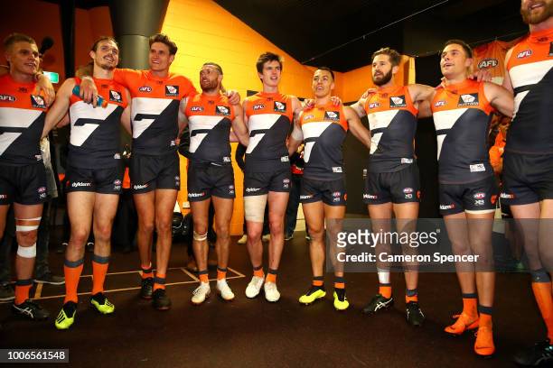 Giants players sing their team song after winning the round 19 AFL match between the Greater Western Sydney Giants and the St Kilda Saints at...