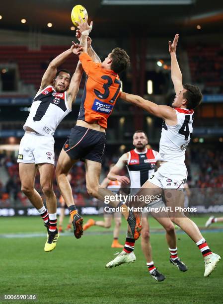 Shane Savage of the Saints is challenged by Rory Lobb of the Giants during the round 19 AFL match between the Greater Western Sydney Giants and the...