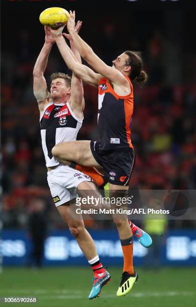 Phil Davis of the Giants competes for the ball against Jack Newnes of the Saints during the round 19 AFL match between the Greater Western Sydney...