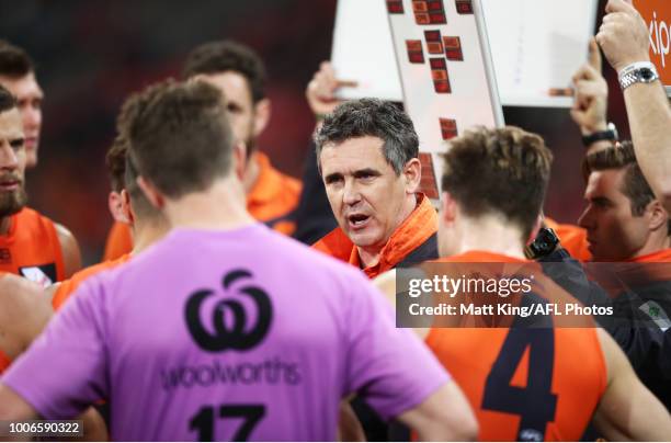 Giants coach Leon Cameron speaks to players at three quarter time during the round 19 AFL match between the Greater Western Sydney Giants and the St...