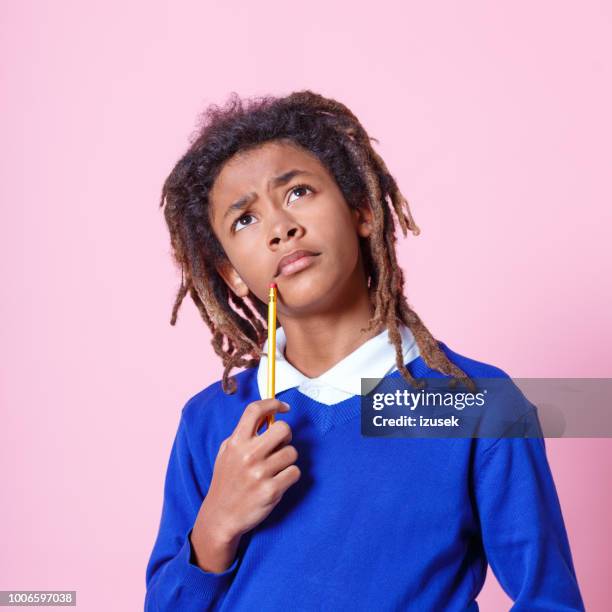 student looking up and thinking - child problem solving stock pictures, royalty-free photos & images