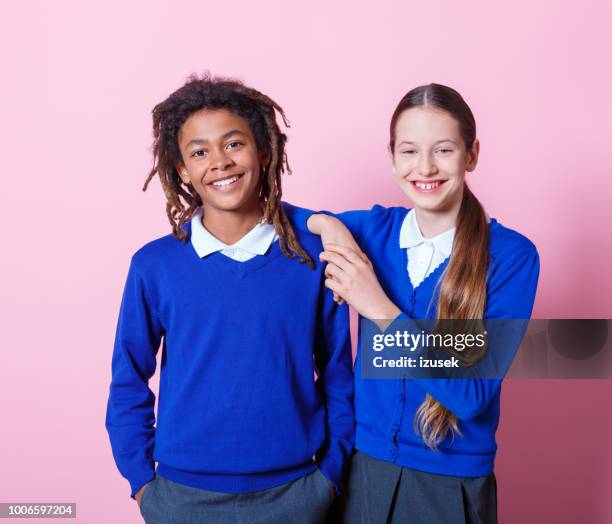 two students standing togehter - boy girl stock pictures, royalty-free photos & images