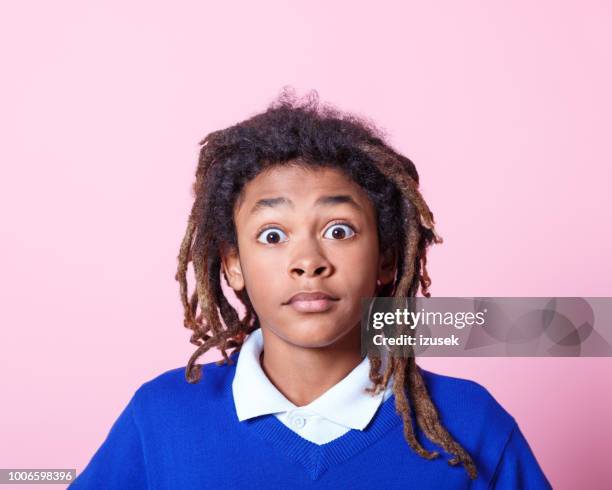 school boy looking surprised - african american school uniform stock pictures, royalty-free photos & images