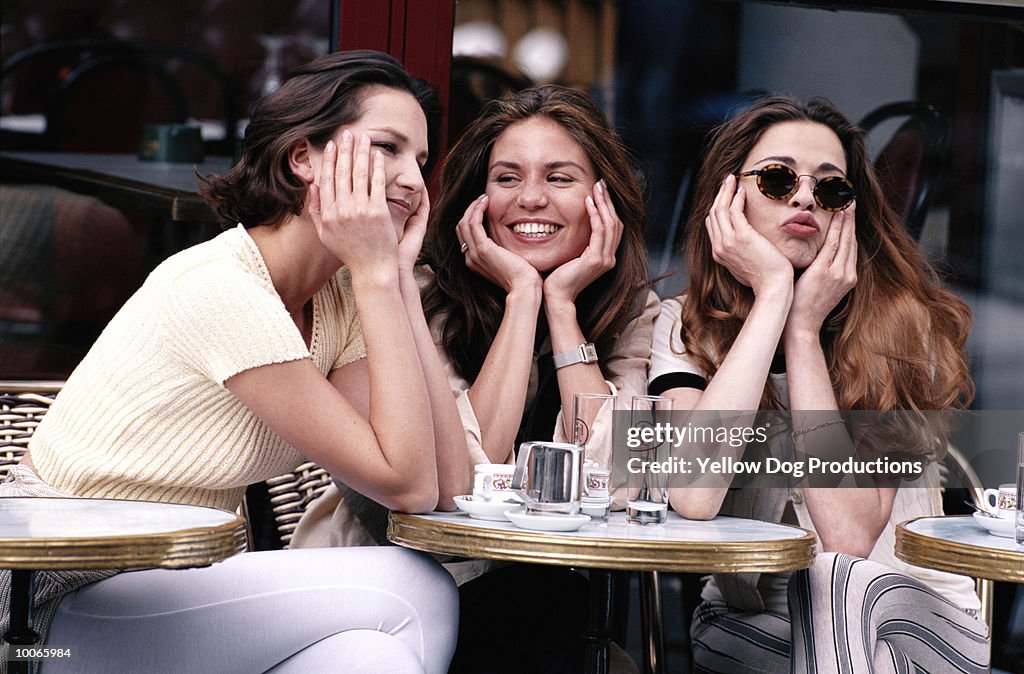 FRIENDS AT A CAFE IN PARIS, FRANCE