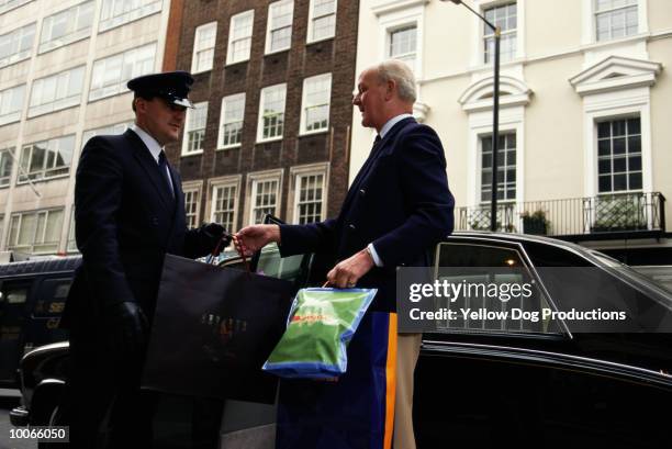 limo for older man in bond street, london, uk - limo chauffeur stock-fotos und bilder