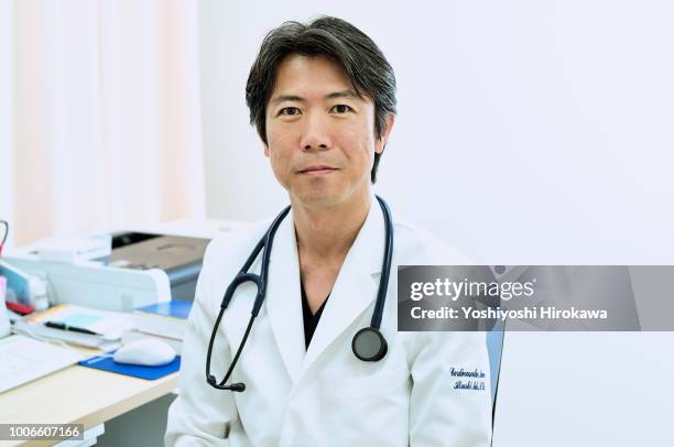 japanese medical doctor portrait in cardiovascular clinic - cardiologist portrait stock pictures, royalty-free photos & images
