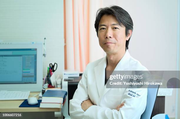 japanese medical doctor portrait in cardiovascular clinic - cardiologist portrait stock pictures, royalty-free photos & images