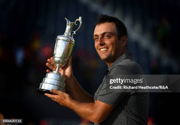 Francesco Molinari of Italy holds the Claret Jug as Champion Golfer after winning the 147th Open Championship at Carnoustie Golf Club on July 22,...