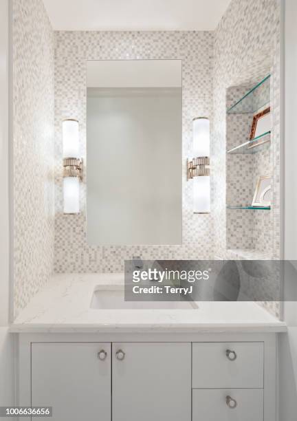 beautiful remodeled bathroom in a condominium - standing mirror stock pictures, royalty-free photos & images