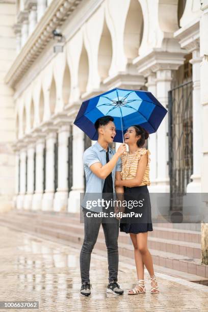 romantic walk on the rain - asia rain stock pictures, royalty-free photos & images