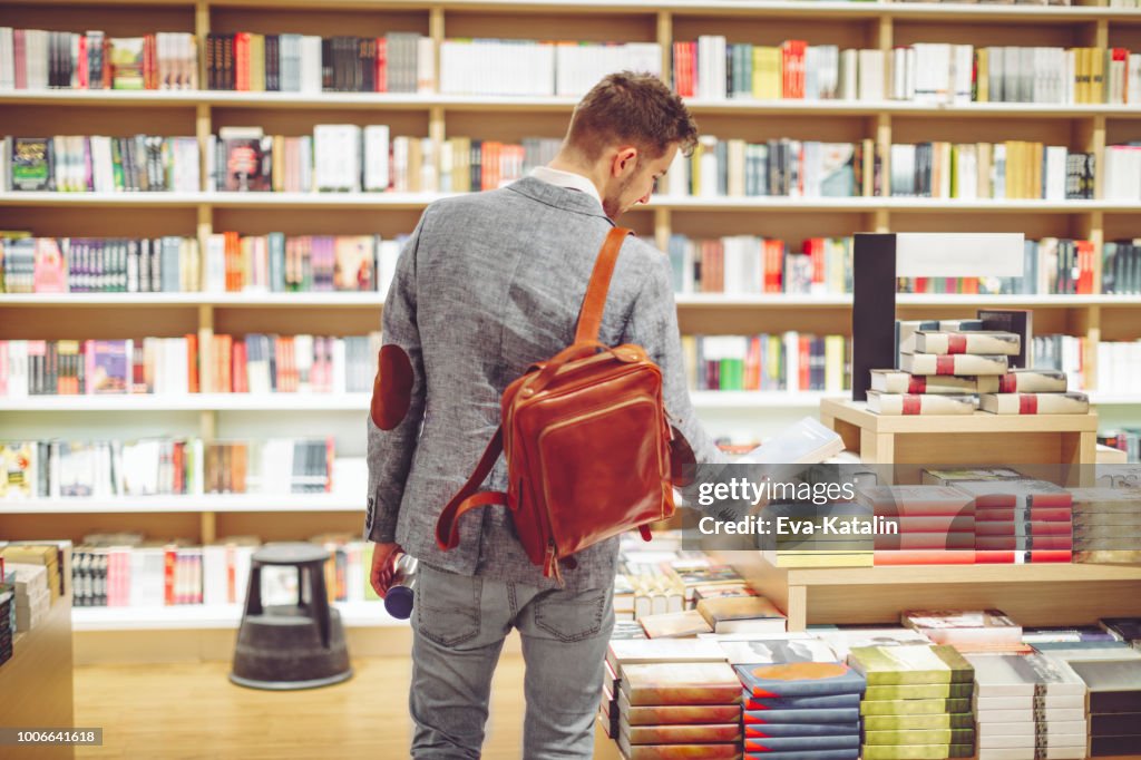 Young man shopping books