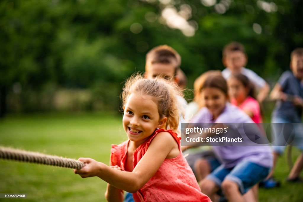 Group of kids pulling a rope