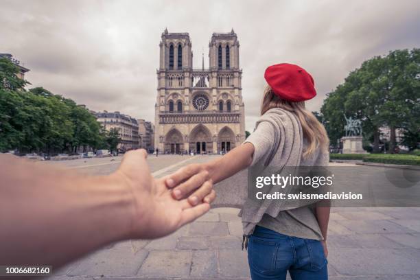travel with me to paris, follow me to concept, girl leading boyfriend to the notre dame de paris - devise de paris stock pictures, royalty-free photos & images