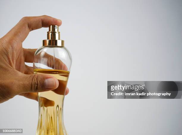 spraying perfume with copy space in white background - perfume sprayer bildbanksfoton och bilder