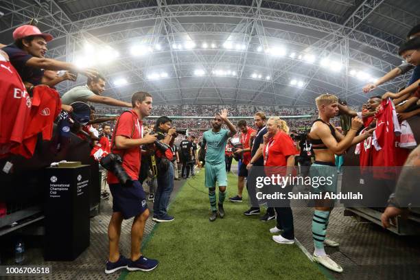 Alexandre Lacazette of Arsenal waves and walks back to the dressing room after receiving the Man of the Match trophy during the International...