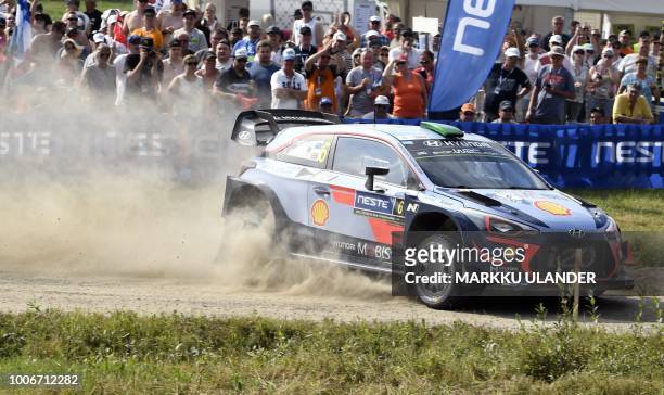 Hayden Paddon from New Zealand and British co-driver Sebastian Marshall steer their Hyundai i20 WRC car during the Kakaristo Special Stage of the WRC...
