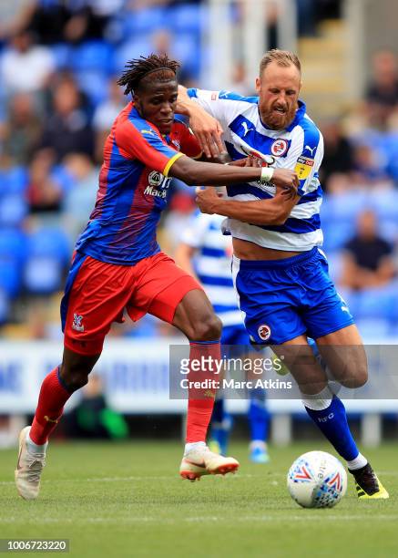 Wilfried Zaha of Crystal Palace in action with David Meyler of Reading during the Pre-Season Friendly between Reading and Crystal Palace at Madejski...