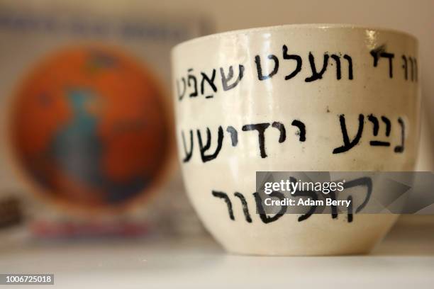 Cup with Yiddish written on it is seen during Yiddish Summer Weimar on July 27, 2018 in Weimar, Germany. The annual five-week summer institute and...