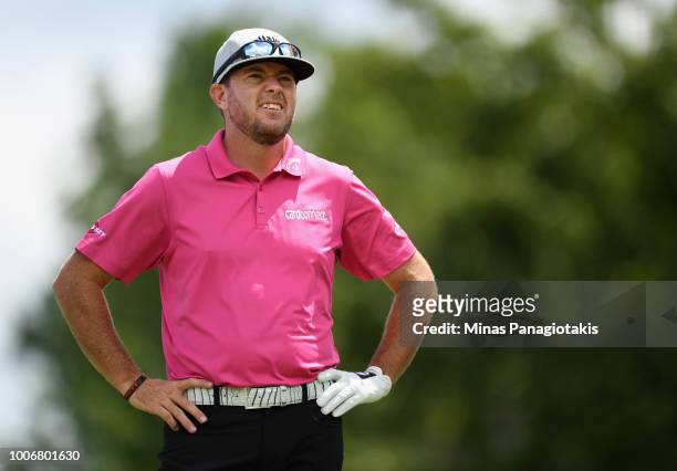 Robert Garrigus prepares to play his shot from the fourth tee during the third round at the RBC Canadian Open at Glen Abbey Golf Club on July 28,...