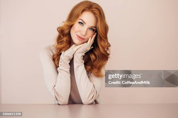 studio shot of young beautiful woman - redhead stock pictures, royalty-free photos & images