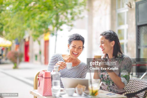mother and adult daughter spending time together - shopping friends family stock pictures, royalty-free photos & images