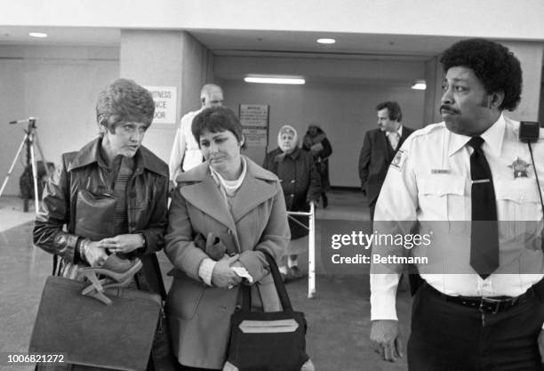 Mrs. Karen Gacy Kuzma, younger sister of mass sex-murder suspect John Wayne Gacy chats with an acquaintance after leaving courtroom where she...