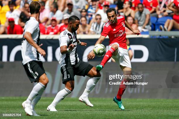 Jonas of Benfica battles for the ball with Emre Can of Juventus during the International Champions Cup 2018 match between Benfica and Juventus at Red...