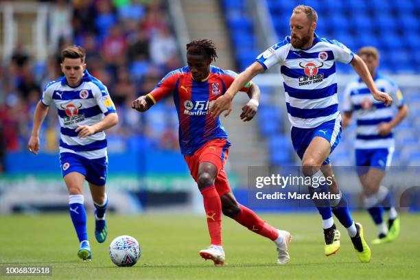 Wilfried Zaha of Crystal Palace in action with Liam Kelly and David Meyler of Reading during the Pre-Season Friendly between Reading and Crystal...