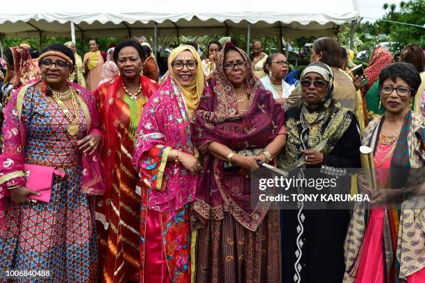 Women in their colourful garbs are pictured at a traditional wedding ceremony in Moroni on July 28 capital of the volcanic Comoros archipelago off...