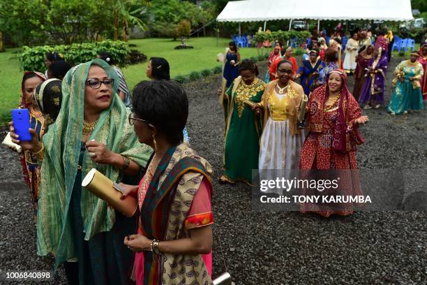 Women in their colourful garbs are pictured at a traditional wedding ceremony in Moroni on July 28 capital of the volcanic Comoros archipelago off...