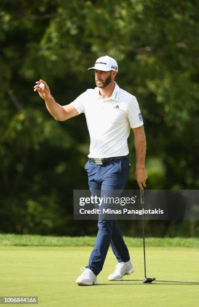 Dustin Johnson reacts to his eagle putt on the 16th hole during the third round at the RBC Canadian Open at Glen Abbey Golf Club on July 28, 2018 in...