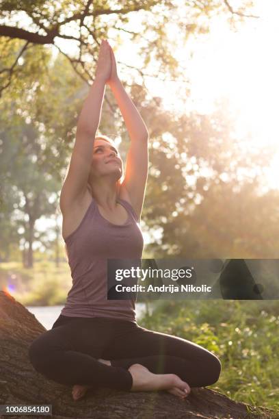 inhale the good, exhale the bad - blonde yoga stock pictures, royalty-free photos & images