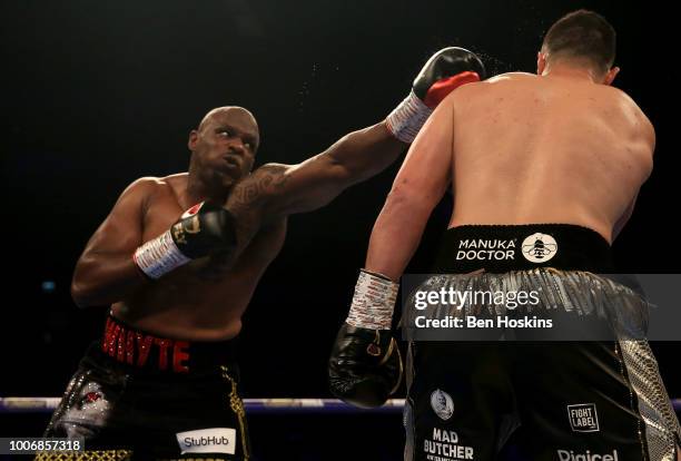 Dillian Whyte punches Joseph Parker during the Heavyweight fight between Dillian Whyte and Joseph Parker at The O2 Arena on July 28, 2018 in London,...