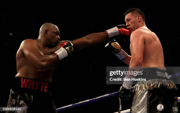 Dillian Whyte punches Joseph Parker during the Heavyweight fight between Dillian Whyte and Joseph Parker at The O2 Arena on July 28, 2018 in London,...